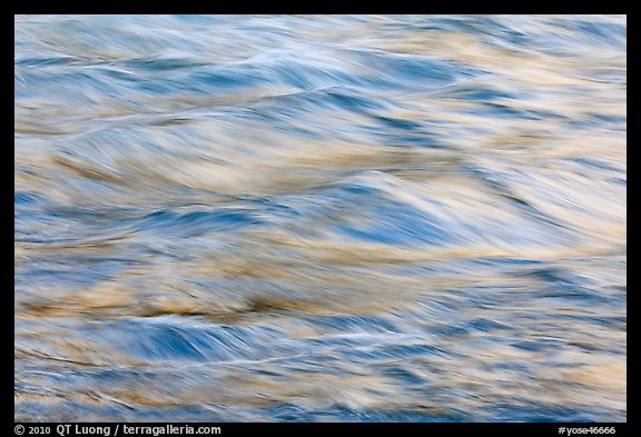 Water reflecting cliff colors. Yosemite National Park, California, USA.