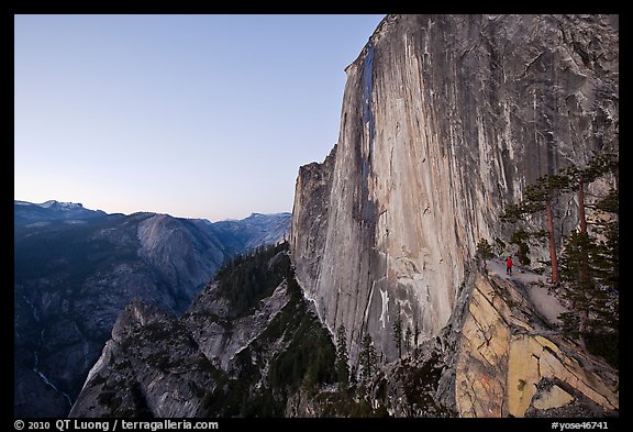 Hiker, Half-Dome and Tenaya Canyon from the Diving Board at dusk. Yosemite National Park, California, USA.