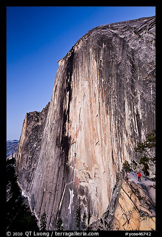 Hiker at the base of Half-Dome at dusk. Yosemite National Park, California, USA.