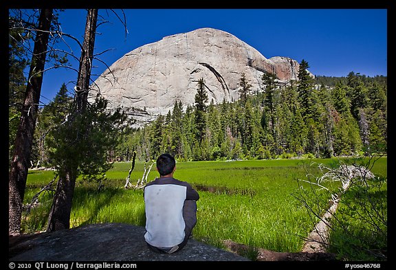 Hiker looking at backside of Half-Dome from Lost Lake. Yosemite National Park (color)