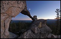 Indian Arch and moon at dusk. Yosemite National Park, California, USA.