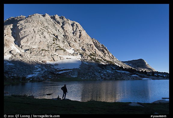 Park visitor looking, Fletcher Lake. Yosemite National Park, California, USA.