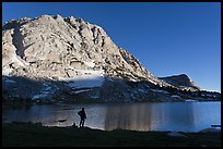 Park visitor looking, Fletcher Lake. Yosemite National Park, California, USA.