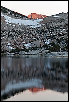 Last light on peak reflected in Vogelsang Lake. Yosemite National Park, California, USA.