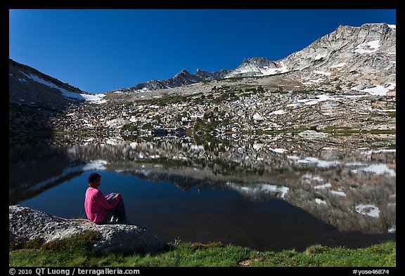 Park visitor looking, Vogelsang Lake and Peak. Yosemite National Park, California, USA.