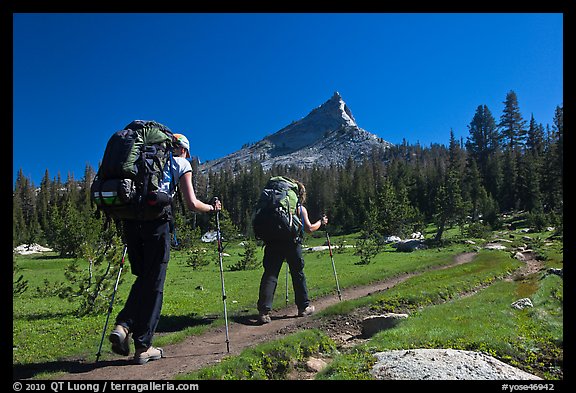 Women backpacking on John Muir Trail below Tressider Peak. Yosemite National Park, California, USA.