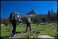 Women backpacking on John Muir Trail below Tressider Peak. Yosemite National Park, California, USA.