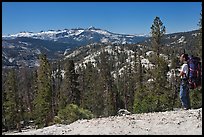 Backpacker surveying high country from Cathedral Pass. Yosemite National Park ( color)