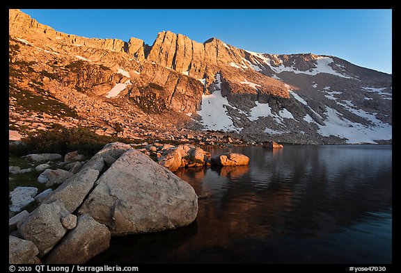 Shore of Upper McCabe Lake with North Peak at sunset. Yosemite National Park, California, USA.