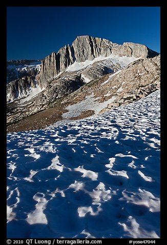 Neve with sun cups on the Sierra Crest, and North Peak. Yosemite National Park, California, USA.