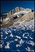 Neve with sun cups on the Sierra Crest, and North Peak. Yosemite National Park, California, USA.