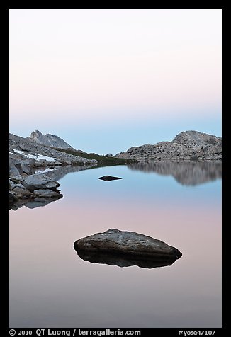 Stone in Roosevelt Lake, dawn. Yosemite National Park, California, USA.