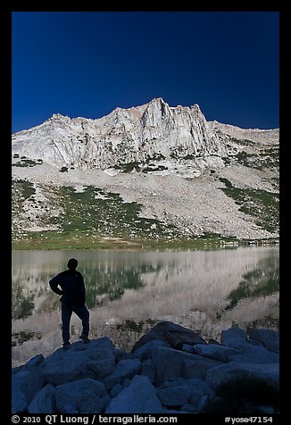 Hiker standing  on Roosevelt lakeshore. Yosemite National Park, California, USA.