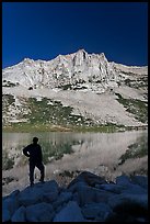 Hiker standing  on Roosevelt lakeshore. Yosemite National Park, California, USA.