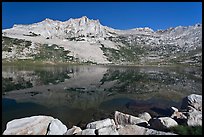 Rugged mountain reflected in Sierra Lake. Yosemite National Park, California, USA.