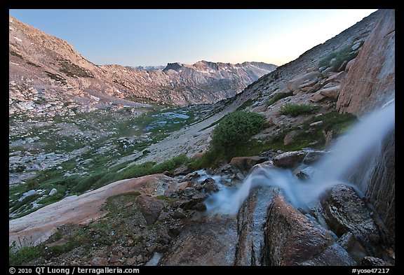 Waterfall and alpine valley at sunset. Yosemite National Park, California, USA.