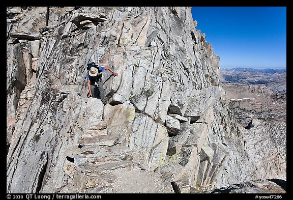 Hiker on summit block of Mount Conness. Yosemite National Park, California, USA.