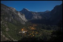 Yosemite Village lights and Half-Dome by moonlight. Yosemite National Park, California, USA. (color)