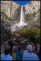 Tourists standing below Bridalvail Fall. Yosemite National Park, California, USA.