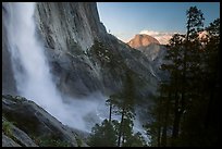 Upper Yosemite Falls and Half-Dome at sunset. Yosemite National Park, California, USA.