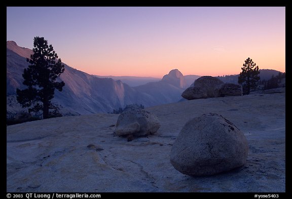 Glacial erratics, pines, Clouds rest and Half-Dome from Olmstedt Point, sunset. Yosemite National Park, California, USA.