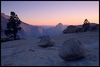 Glacial erratics, pines, Clouds rest and Half-Dome from Olmstedt Point, sunset. Yosemite National Park, California, USA.