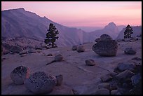 Erratic boulders, pine trees, Clouds rest and Half-Dome from Olmstedt Point, sunset. Yosemite National Park, California, USA.