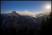 Half-Dome, fire, and moon. Yosemite National Park, California, USA.