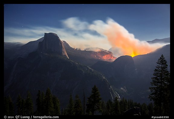 Half-Dome and wildfire at night. Yosemite National Park, California, USA.