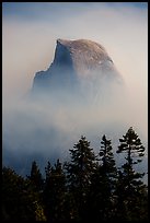 Half-Dome emerging from smoke at night. Yosemite National Park ( color)