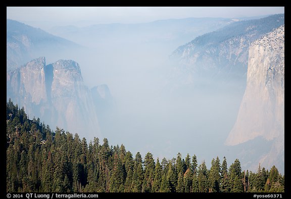 Smoky Yosemite Valley framed by Cathedral Rocks and El Capitan. Yosemite National Park, California, USA.