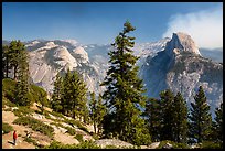 Visitor looking, Half-Dome from Glacier Point. Yosemite National Park, California, USA.