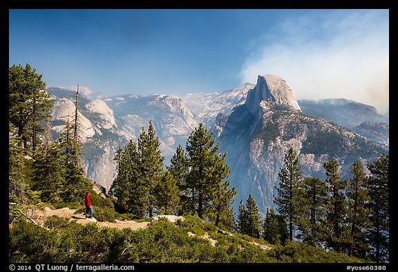 Visitor looking, Glacier Point. Yosemite National Park (color)