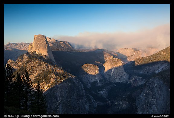 Half-Dome and forest fire from Washburn Point, late afternoon. Yosemite National Park (color)