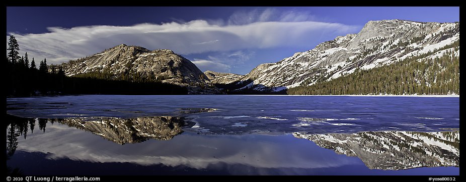 Mountains reflected in partly iced Tenaya Lake. Yosemite National Park (color)