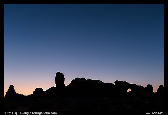 Windows Group silhouette at dawn. Arches National Park, Utah, USA.