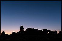 Windows Group silhouette at dawn. Arches National Park, Utah, USA. (color)