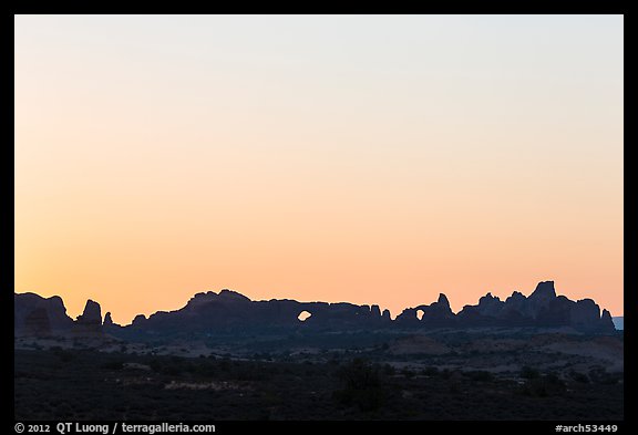 Windows Group backlit at sunrise. Arches National Park, Utah, USA.