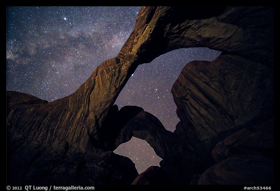 Double Arch at night with Milky Way. Arches National Park, Utah, USA.