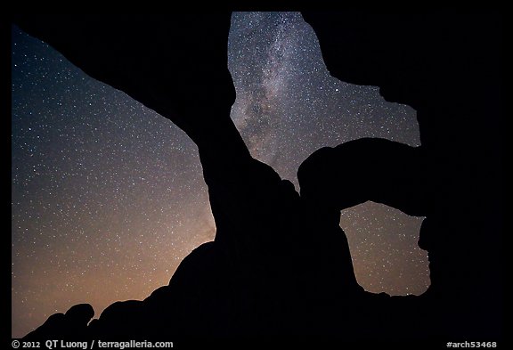 Double Arch with starry sky and Milky Way. Arches National Park, Utah, USA.