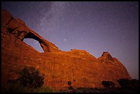 Skyline Arch at night with starry sky. Arches National Park, Utah, USA.