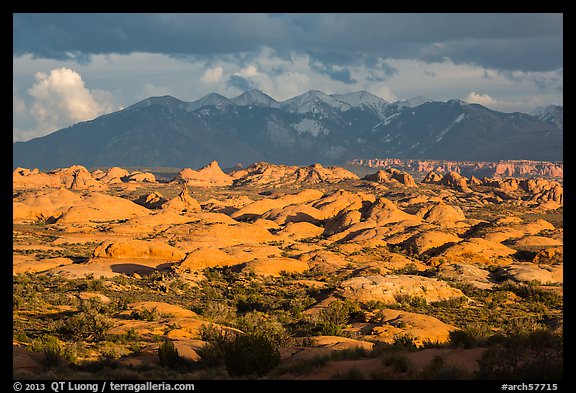 Petrified dunes and cloudy La Sal mountains. Arches National Park (color)