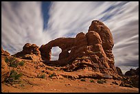 Turret Arch at night, lit by moon. Arches National Park, Utah, USA.