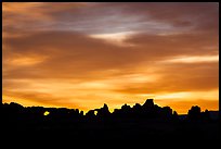 Windows and Turret Arch silhouetted at sunrise. Arches National Park, Utah, USA. (color)