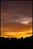 Windows and Turret Arch silhouetted against colorful clouds. Arches National Park ( color)