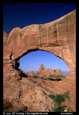 Turret Arch seen through South Window, morning. Arches National Park, Utah, USA.