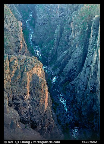 View down steep rock walls and narrow chasm. Black Canyon of the Gunnison National Park, Colorado, USA.