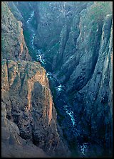 View down steep rock walls and narrow chasm. Black Canyon of the Gunnison National Park, Colorado, USA.