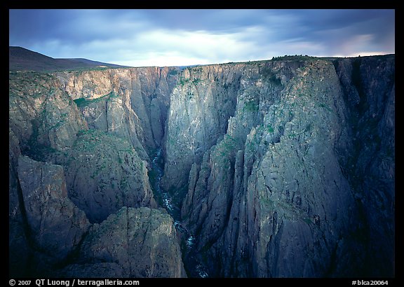 Narrow gorge under dark clouds. Black Canyon of the Gunnison National Park, Colorado, USA.