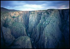 Narrow gorge under dark clouds. Black Canyon of the Gunnison National Park, Colorado, USA.